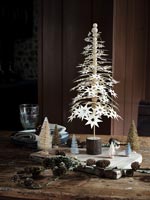 Small paper star tree surrounded by other miniature trees - Christmas display
