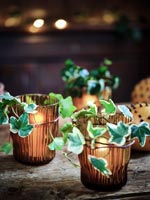 Ivy foliage decorating glass tealight holders 