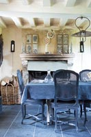 Dark grey dining table and chairs in country dining room 