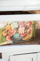 Decorative tin in dresser - detail 