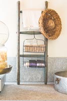 Small piece of wooden ladder repurposed for kitchen storage