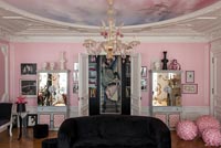 Bright pink eclectic living room with period details 