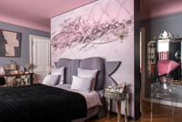 Mural on feature wall of eclectic modern bedroom 