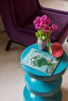 Detail of colourful modern turquoise side table 