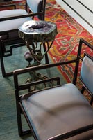 Detail of Art Deco style chairs and unusual side table 
