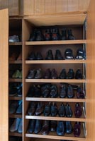 Large shoe racks inside built-in wardrobes 