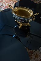 Decorative pot on black coffee table - detail 