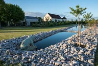 Unusual water feature in modern country garden 