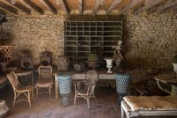 Rustic covered seating area with wicker chairs 