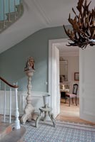 Classic style hallway with antler light fitting 