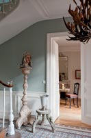 Classic style hallway with antler light fitting 