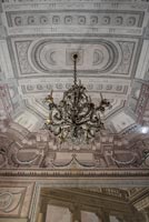Classic chandelier with view of ornate ceiling 