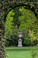 Large ornamental urn in formal garden 