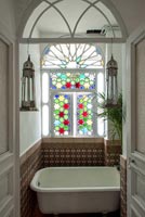 Colourful stained glass windows in classic style bathroom 