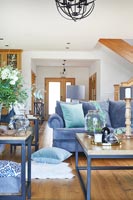 Blue furniture in wooden living room 
