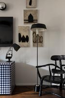 Black, white and grey paintings and furniture 