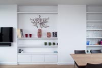 Built-in shelving and units in small open plan living space 