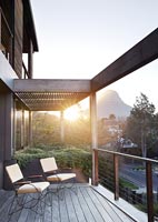 Chairs on decked modern balcony 