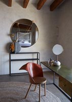 Dressing table and unusual chair in modern country bedroom 