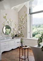 Modern country bathroom with scenic views through window