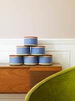 Collection of decorative hat boxes on sideboard 