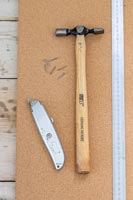 Ruler, Stanley knife and nails on cork board - Memories Notice board 