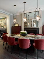 Unusual pendant lights over table in classic style dining room 