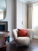 Upholstered armchair in modern living room 