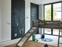 Raised loft bed in modern childrens room 