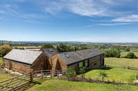 Country house exterior with scenic countryside views beyond 
