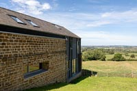 Country house exterior with views of countryside beyond 