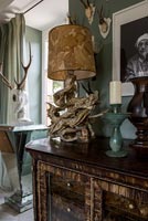 Ornate sideboard and hunting trophy wall display