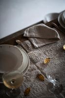 Detail of gold leaf decorations on country dining table