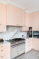 Modern pink kitchen with large range cooker 