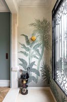 Umbrella stand and wall mural in retro style hallway 