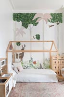 Modern childrens room with timber frame bed