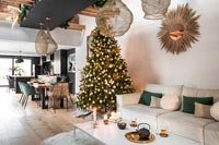 Modern open plan living and dining space decorated for Christmas 