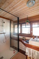 Modern shower cubicle in country bathroom 