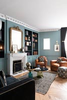 Classic style living room with blue painted walls 