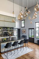 Modern kitchen with display of pendant lights 