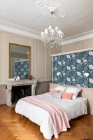 Floral feature wall behind bed in classic style bedroom 