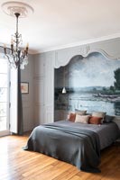 Fresco painting on alcove wall behind bed in classic style bedroom 