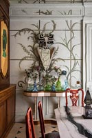 Unusual console table in eclectic dining room 