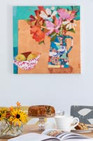Colourful modern artwork above dining table 