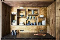 Modern wooden kitchen with wall mounted box shelves