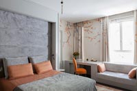 Modern bedroom with upholstered wall above bed 