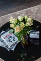 Roses in vase on coffee table 