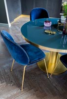 Blue and gold dining table with velvet chairs 