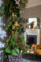 Detail of Christmas garland with living room in background 