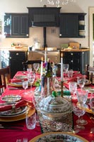 Country kitchen-diner - dining table laid for Christmas dinner 